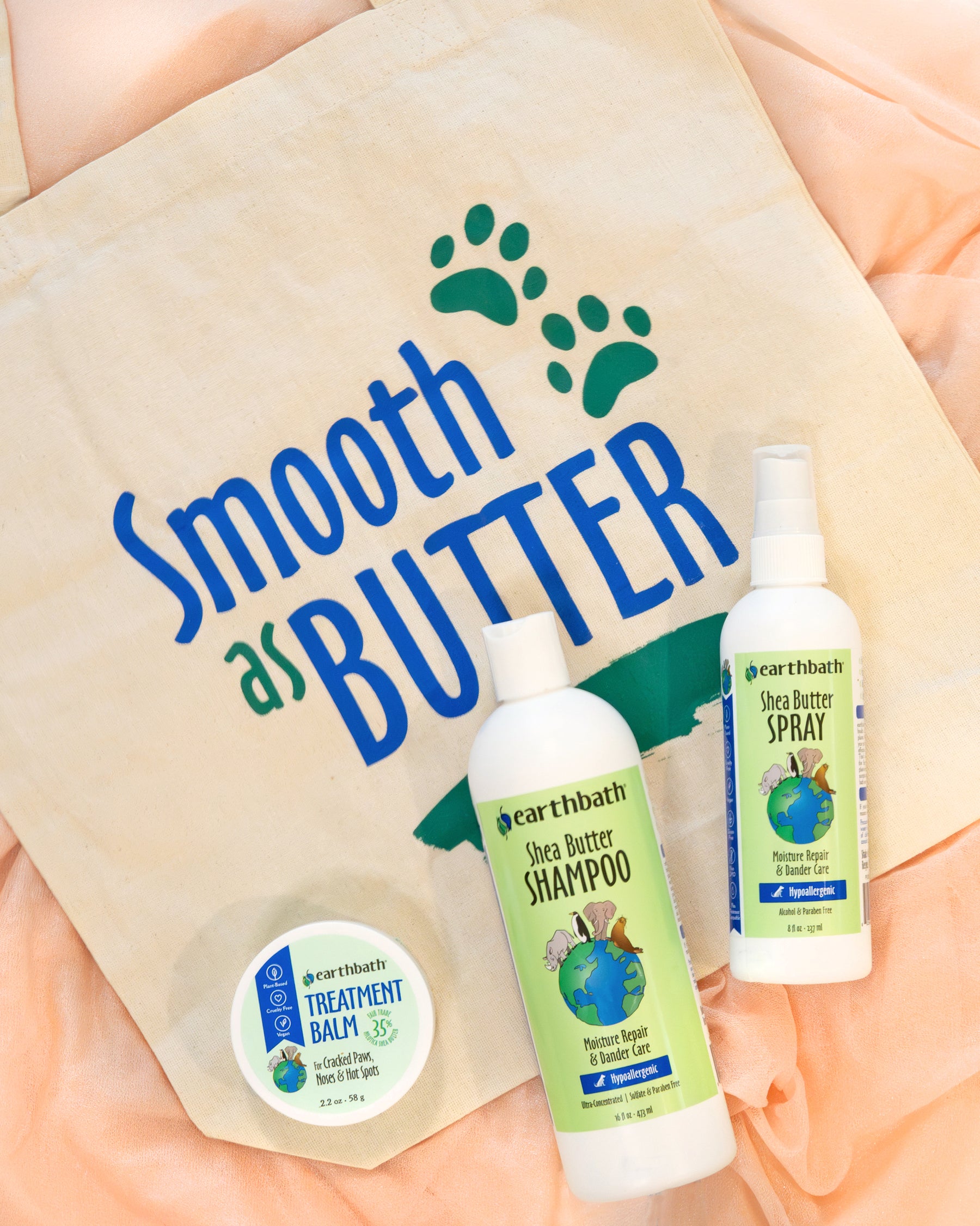 2 bottles of Shea Butter Shampoo, 1 treatment balm and a bag with text "Smooth as Butter" 