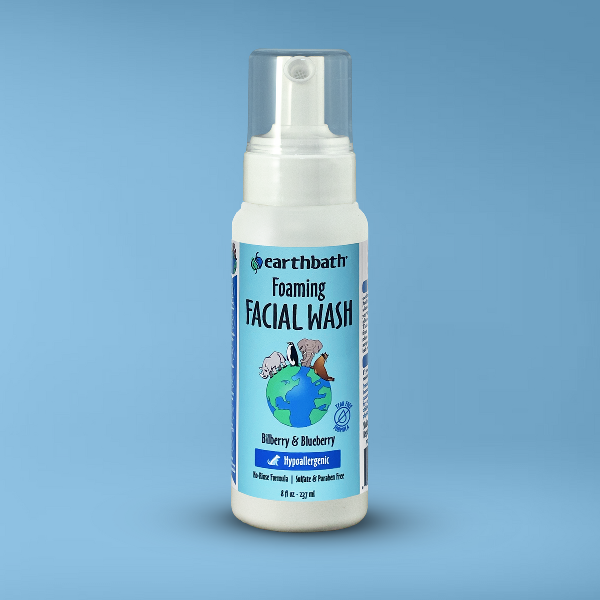 A bottle of earthbath foaming facial wash for pets, featuring a white dispenser with a label that includes a blueberry and bilberry image and text on blue background.